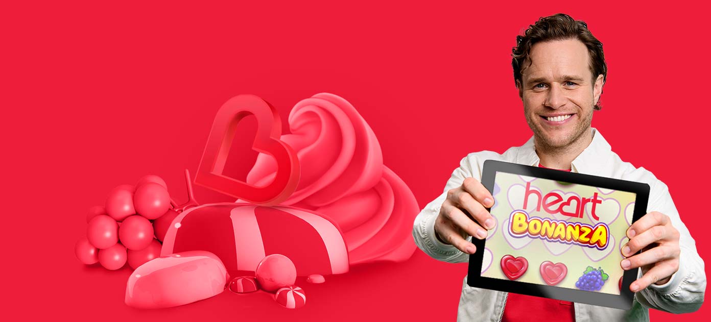 Olly Murs showing a tablet featuring daily free to play game